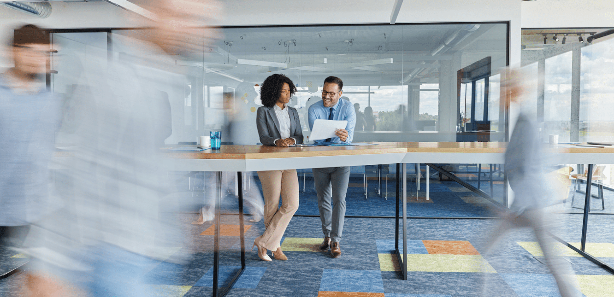 people talking at desk