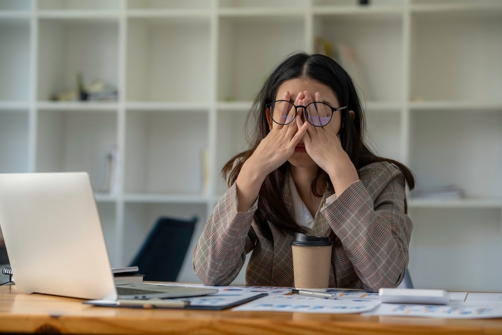 Stressed woman, working in a office